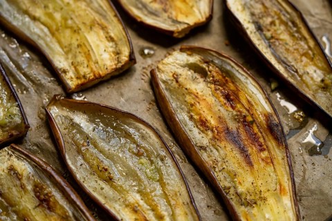 Close-up of oven roasted eggplant slices showcasing a rustic, healthy dish perfect for vegetarian