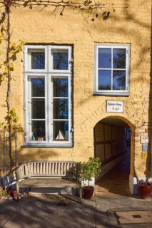 Historic building, Donats Gang, bench, window, flower pots with plants, street An der Obertrave,