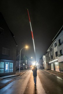Transport of a 68 metre long, 22 tonne blade of a wind turbine, here in Breckerfeld, with a