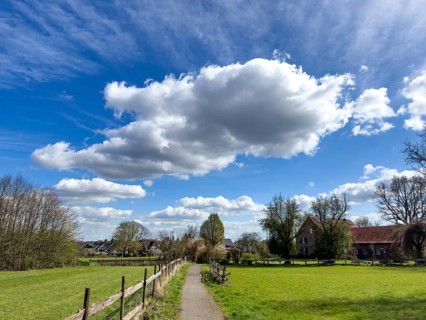 Large cumulus clouds Cumulus with dark underside above Cirrus clouds Cirrus move across rural