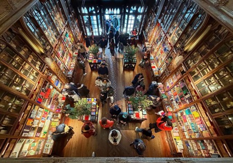 Livraria Lello, interior view of Lello bookstore with many tourists, admission control,