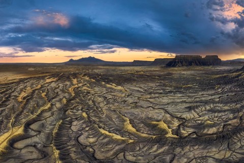 A breathtaking view of sunset casting dramatic shadows across the wrinkled landscape of Factory