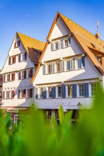 Traditional half-timbered houses and café in sunny weather and blue skies, Weil der Stadt,