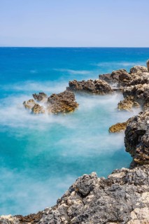 Romantic view over the sea in Koromacna Bay on a sunny day with rough seas on the island of Cres,