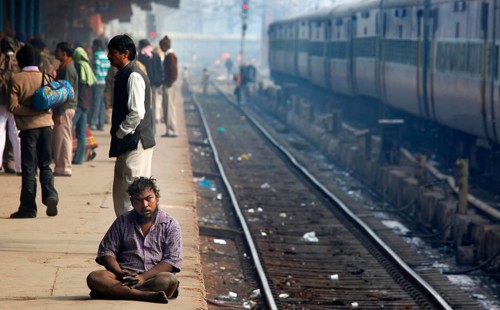 New Delhi, India, 15.01.10 - Station in Neu-Dehl, beggar on the platform, India