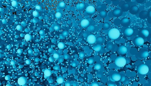 An abstract image showcasing numerous blue spheres of various sizes in a 3D space, creating a