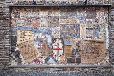 Relief and text about the city's history, scroll, city coat of arms, wall mosaic, Zell an der