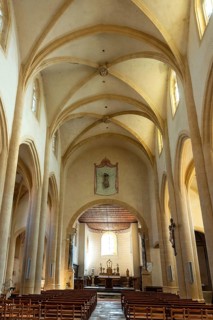 Interior of Saint-Sebastien Church in Manglieu, featuring Romanesque arches, Puy de dome