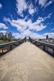 Iron footbridge with a view of the Mainkai and the skyscrapers in Frankfurt am Main, Hesse, Germany
