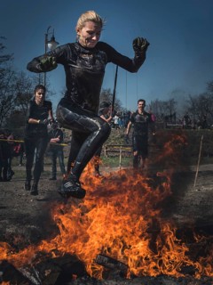 WROCLAW, POLAND - APRIL 7, 2018: Extreme running with obstacle RUNMAGEDDON. In the picture a runner