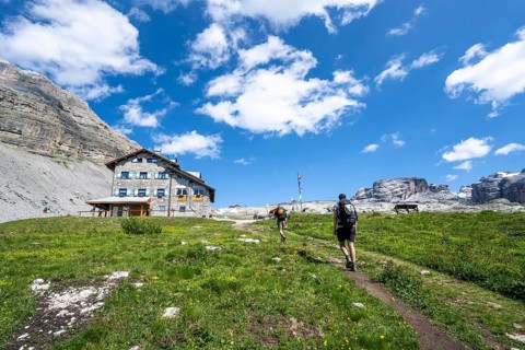 Hikers in front of Rifugio Graffer, Brenta, Brenta-Adamello Natural Park, Trentino, Italy