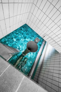 Basin with clear water and white tiles and visible pipework, ENCW Netze Calw waterworks, Calw,