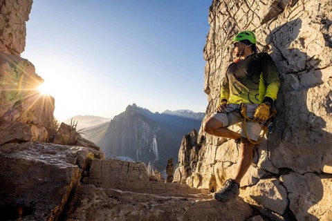A mountaineer takes a break while practicing climbing and rappelling at Eagleâ€™s Nest in
