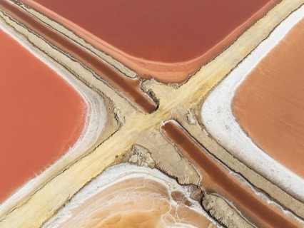 Saline ponds at the Bonanza salt works near Sanlúcar de Barrameda. The reddish colour depends on