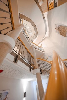 Spiral staircase in modern design with concrete and wooden details, Hotel Krone Lamm, Zavelstein,
