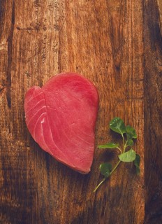 Fresh red tuna fillet, for steak, raw, top view, on a cutting board, no people