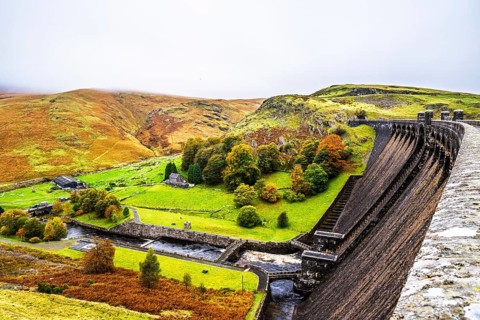 Autumn colors over Claerwen Dam, Claerwen Valley, Elan Valley Reservoir, Rhayader, Powys, Wales, UK