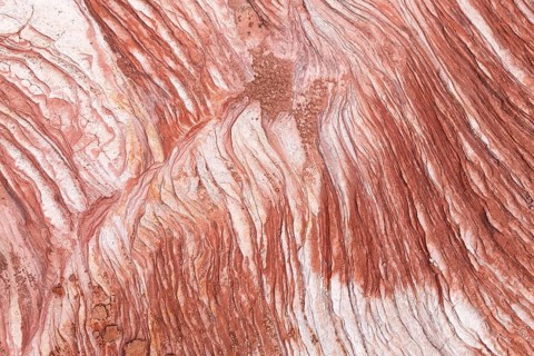 Discover the intricate patterns and rich hues of the desert rock formations at Vermilion Cliffs