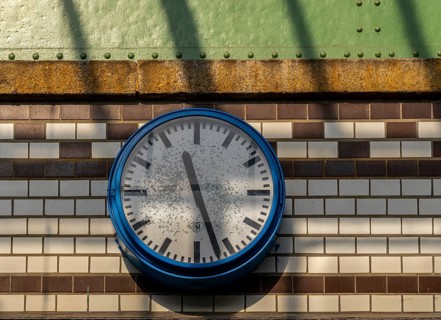 Old station clock on a tiled wall at Lichterfelde West S-Bahn station, Berlin, Germany