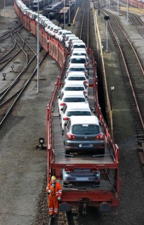Wolfsburg, DEU, 250211 - Car transport wagons with new Volkswagen Golf and Tiguan vehicles on the
