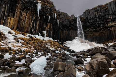 Waterfall, stream, basalt columns, snow, ice, winter, Svartifoss, Iceland, Scandinavia