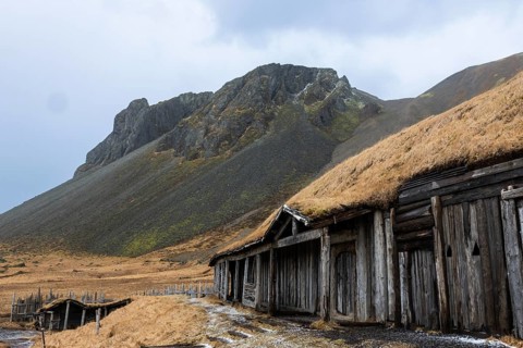 Wickinger buildings against mountain backdrop, winter, Stokksnes, Vestrahorn, Klifatindur, Höfn,