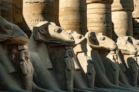 At the entrance to Karnak Temple the Avenue of Sphinxes, statues with the head of a Ram and the