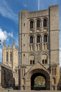 Norman tower, also called church gate, behind it St Edmundsbury Cathedral, Bury St Edmunds, West