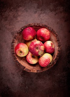 Apples in a wooden bowl, top view, yellow - red, summer variety, early, no people