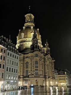 Illuminated Church of Our Lady in Dresden at night, surrounded by historic buildings, Dresden