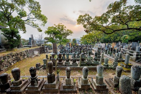 Tombstones at cemetery at sunset, Konkai-Komyoji Temple, Kurodanicho, Kyoto, Japan