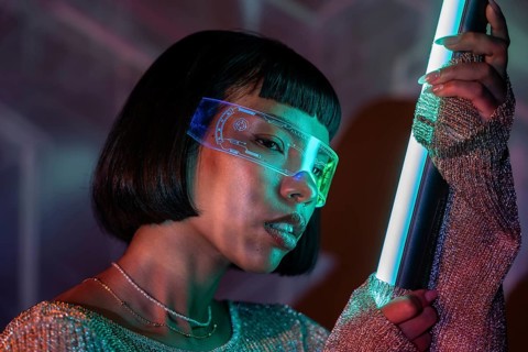 Latin woman wearing futuristic virtual reality glasses, immersed in a captivating digital
