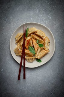 Japanese fried gyoza dumplings, with pork, sesame seeds, green onions