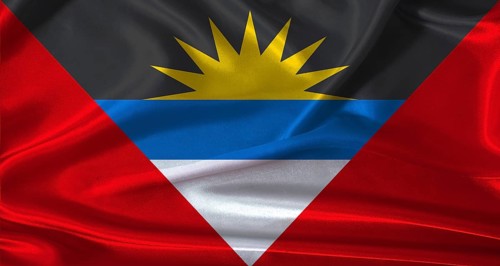 National flag of Antigua and Barbuda with cloth texture. Antigua and Barbuda flag with realistic
