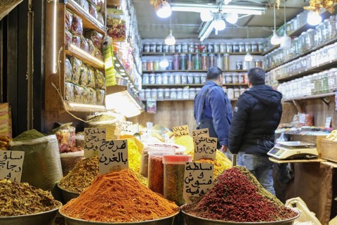 Syrians shop at the historic Al-Hamidiyah Bazaar adjacent to the Umayyad Mosque during the early