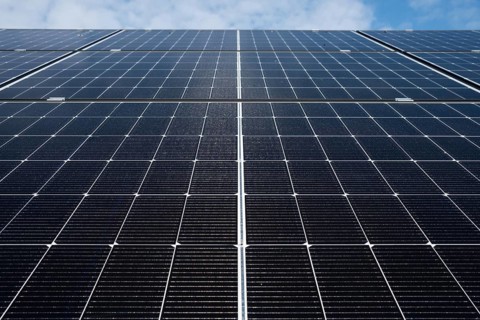 Photovoltaic panels close up with blue sky above