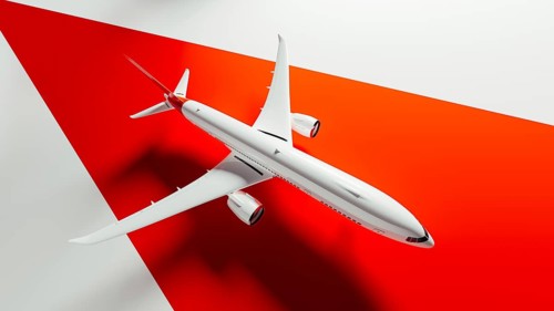 A sleek commercial airplane flies gracefully above bold geometric shapes, highlighting the