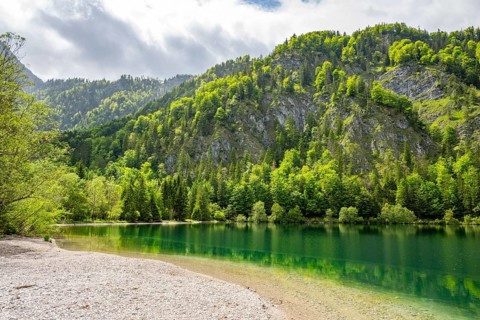 Landscape of Lake Offensee after rain when the sun comes through the clouds in spring,