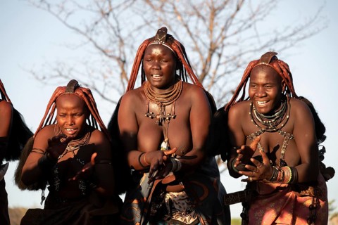 Himba woman dancing euphorically, traditional dance, traditional Himba village, Kaokoveld, Kunene,