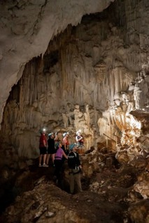 Visitors in a stalactite cave, tourists looking at stalactites in the Terciopelo Cave, Barra Honda
