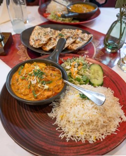 Mango Chicken, chicken in fresh mango-saffron cashew nut almond sauce and served with rice in an