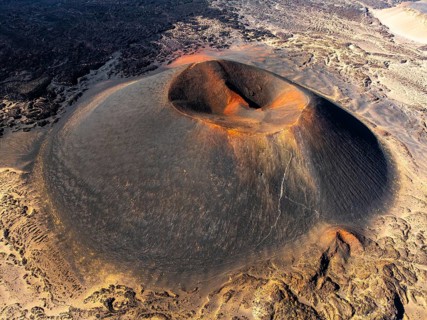 Aerial view of the majestic Antofagasta Volcano in Catamarca, Argentina. The sunrise casts a