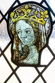 Stained glass window depiction of medieval woman face, Bristol cathedral church, Bristol, England,