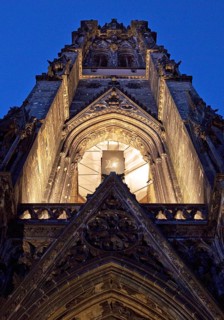 Illuminated church tower of the St. Nikolai memorial, ruins of the former main church of St.