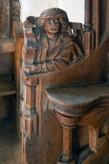 Figure on the late Gothic choir stalls from 1507, St Martin, Memmingen, Bavaria, Germany