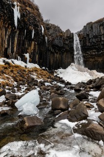 Waterfall, stream, basalt columns, snow, ice, winter, Svartifoss, Iceland, Scandinavia