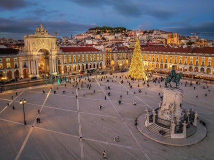 Praca do Comercio in Lisbon features a stunning Christmas tree, surrounded by festive lights, as