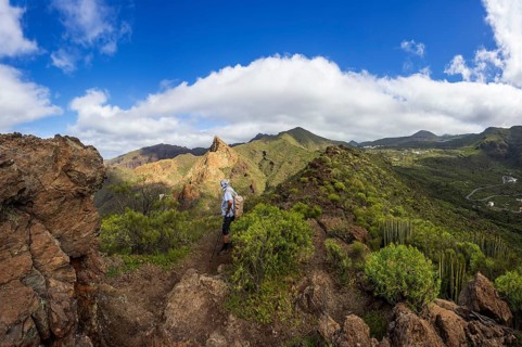 Mountain hike over Santiago Valley, Montana de Guama, hiker with view to Risco Blanco, Tenerife,