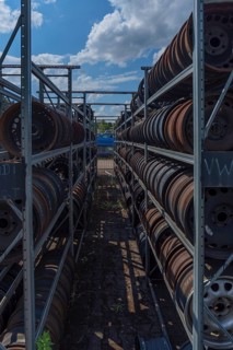 Shelf storage with sorted car rims at a scrap yard, Bavaria, Germany
