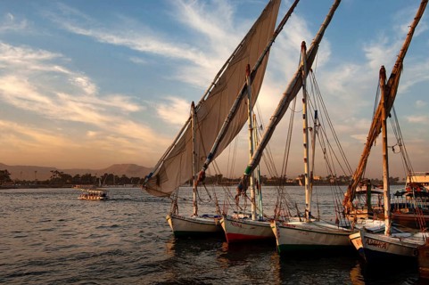 Luxor, Egypt. February 11th 2009 Felucca sail boats moored along side the River Nile at Luxor,